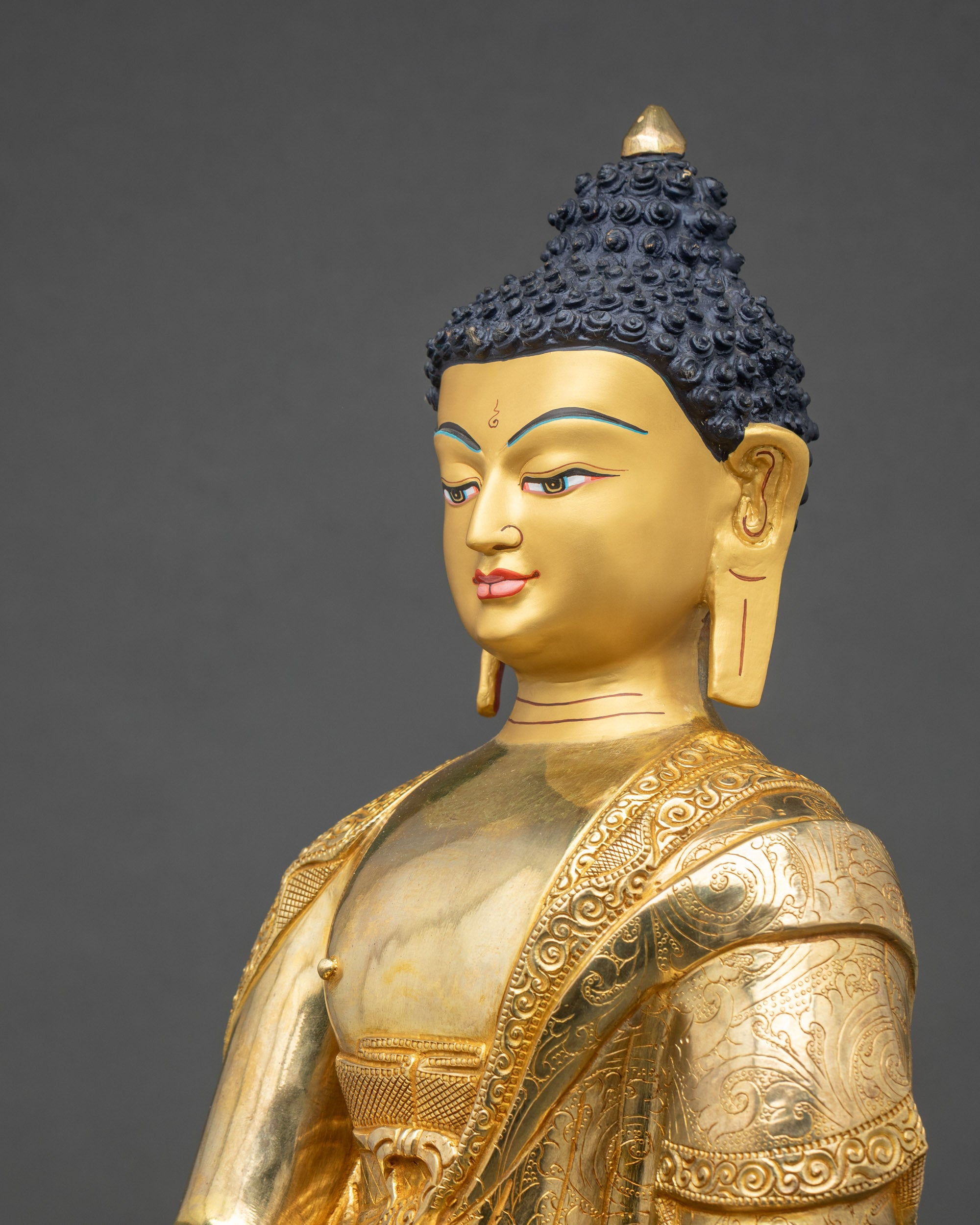 Shakyamuni Buddha face close-up, serene expression, gold-painted features