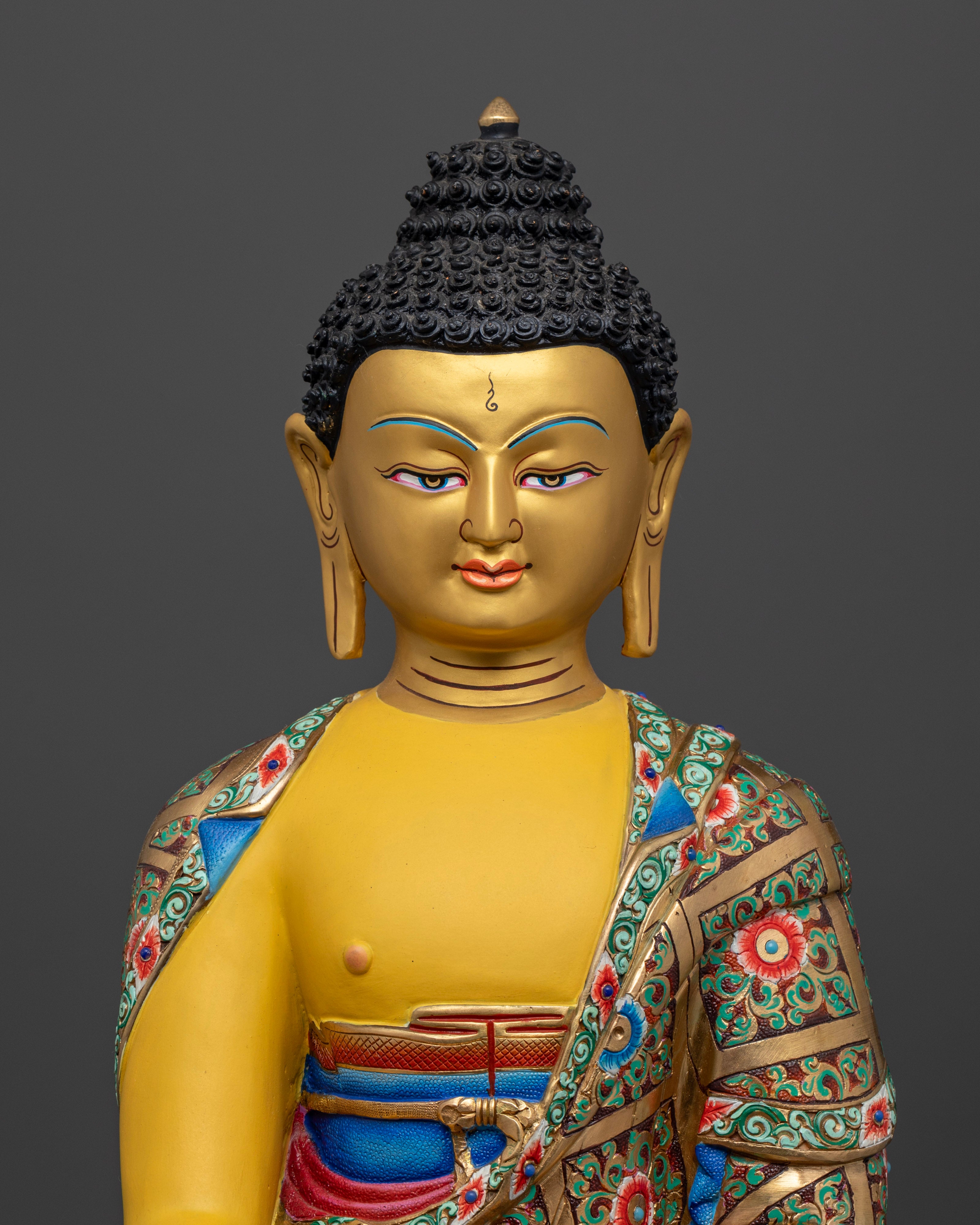 Shakyamuni Buddha’s glowing yellow body and peaceful expression, highlighting the intricate details of the robe and the symbolic monk’s bowl representing simplicity and detachment.