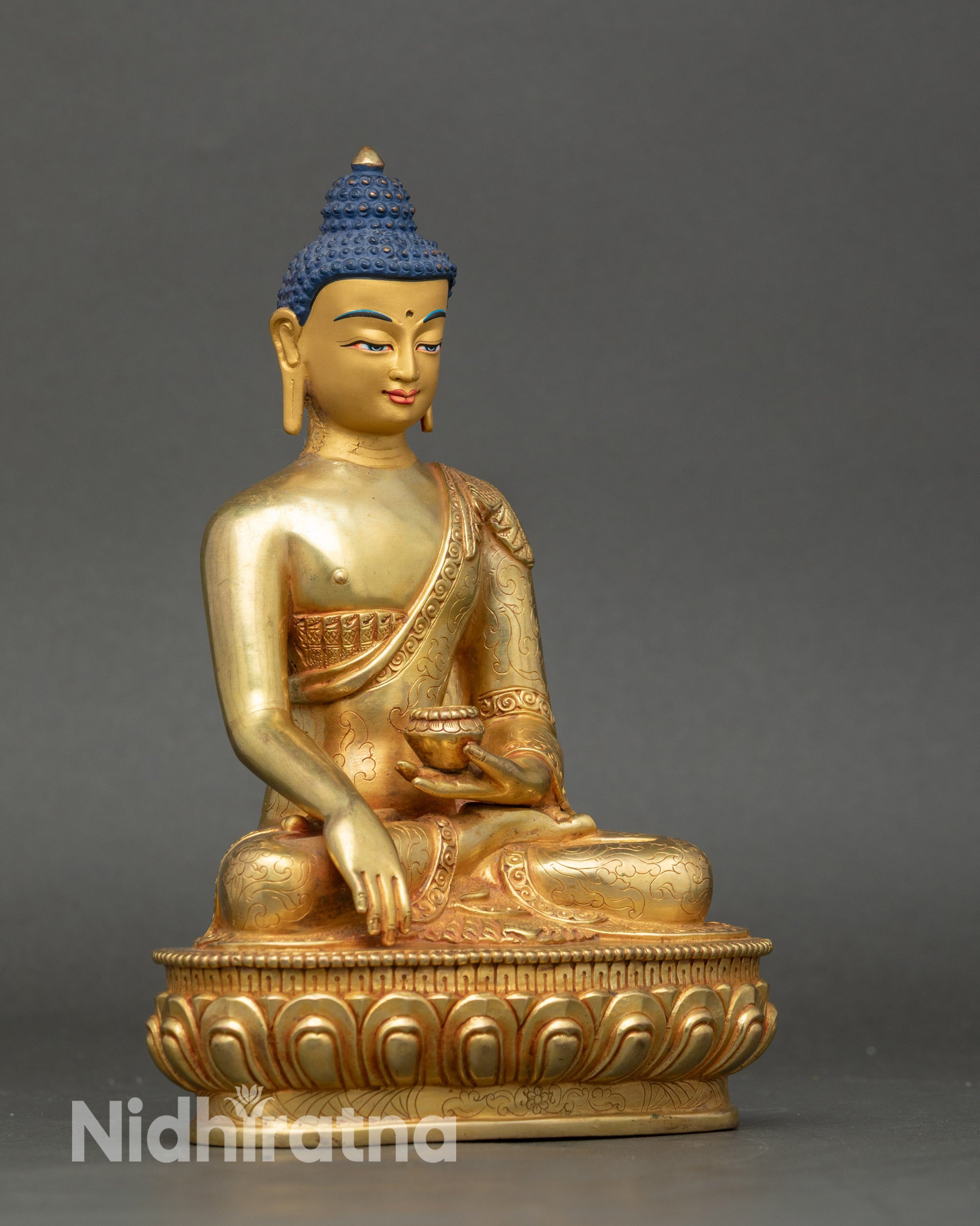 Shakyamuni Buddha holding alms bowl in meditation pose copper gilded statue