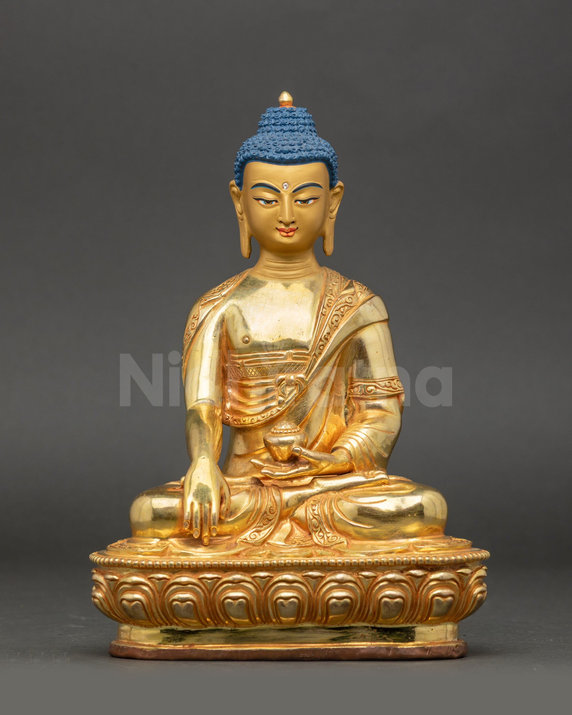 Shakyamuni Buddha idol with gold gilding, seated ona  lotus throne in an earth-touching gesture