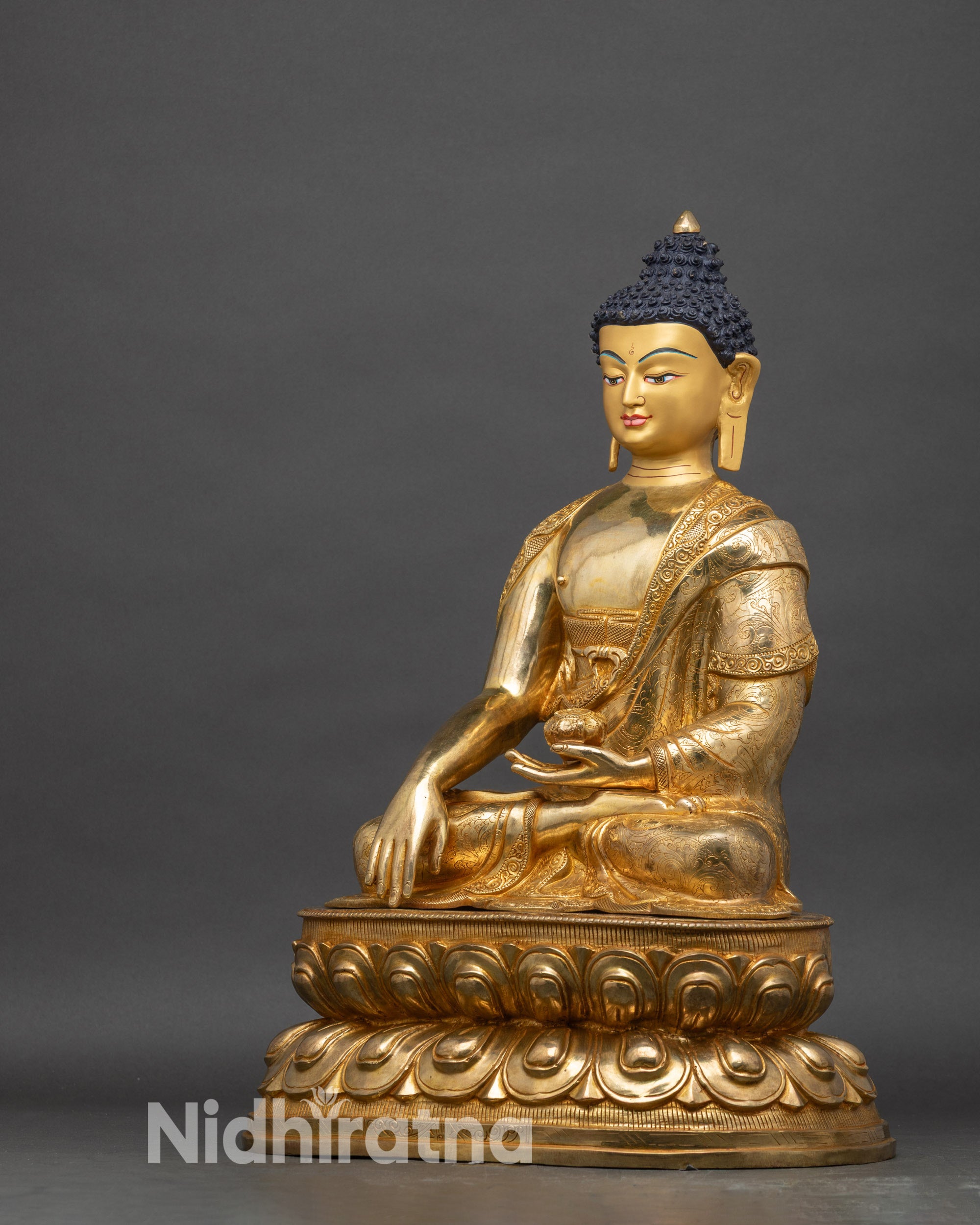 Shakyamuni Buddha left profile, detailed hand-carved robes and gold fire-gilding