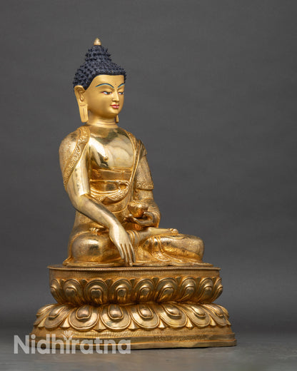 Shakyamuni Buddha right profile, copper statue with lotus seat and gold accents