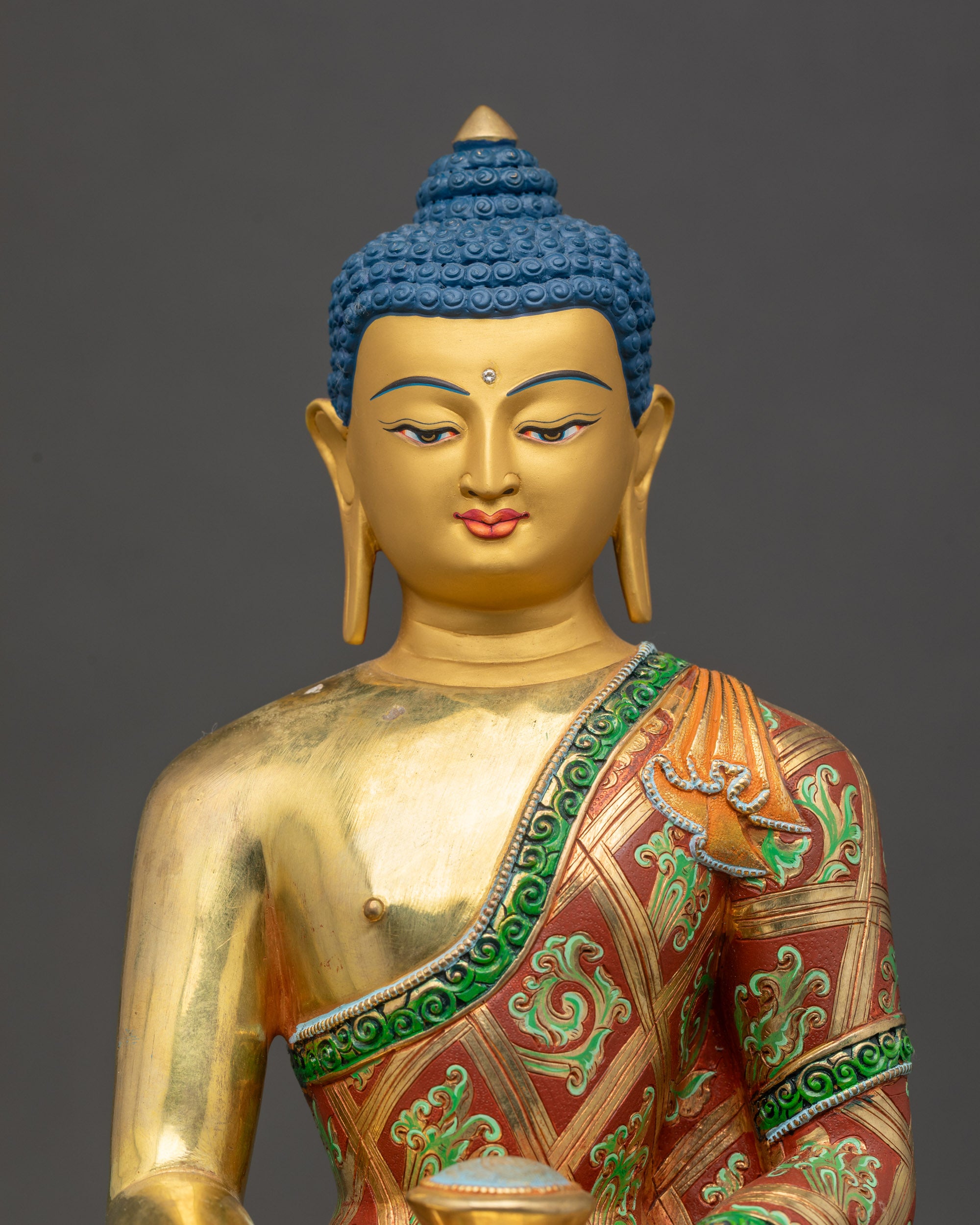 Shakyamuni Buddha sculpture close up gold fire-gilded Nepalese artwork