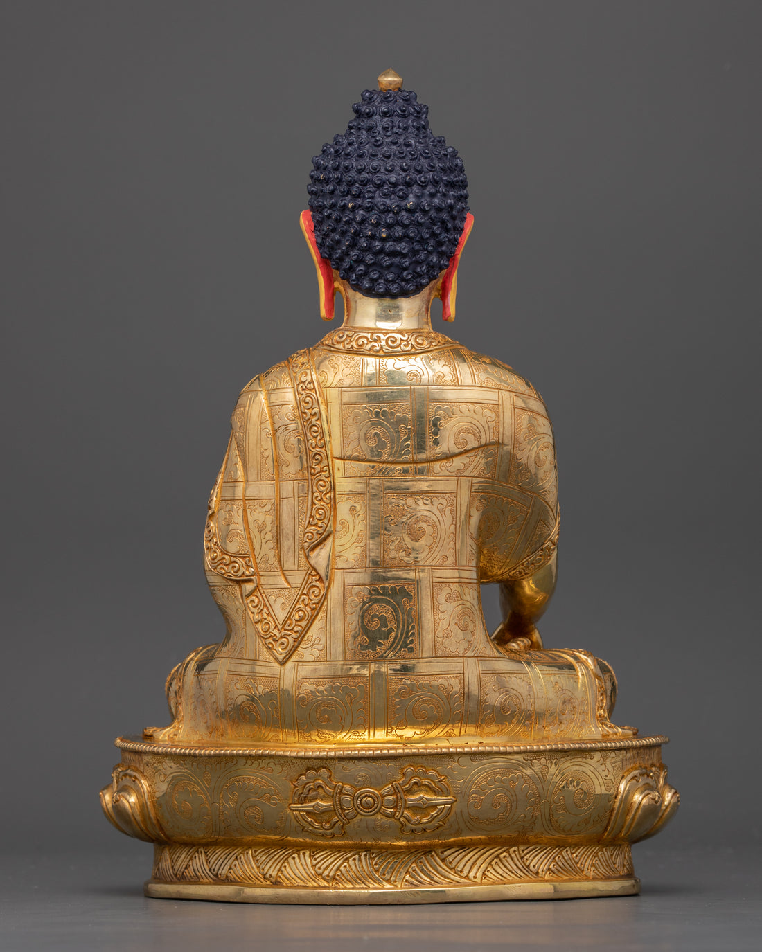 back side of gold plated Shakyamuni Buddha statue