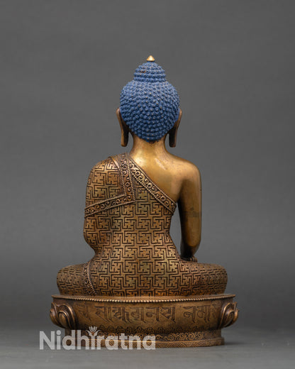 Shakyamuni Buddha statue back view showing double-lotus pedestal and engraved mantra