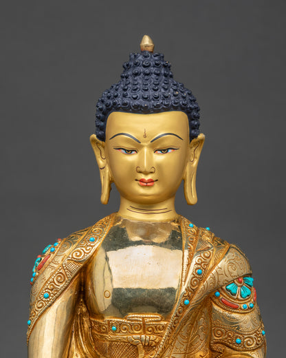 Shakyamuni Buddha statue close up with turquoise coral inlaid robes and lotus pedestal details