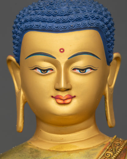 Shakyamuni Buddha statue gold-painted face intricate 3D detailing close up