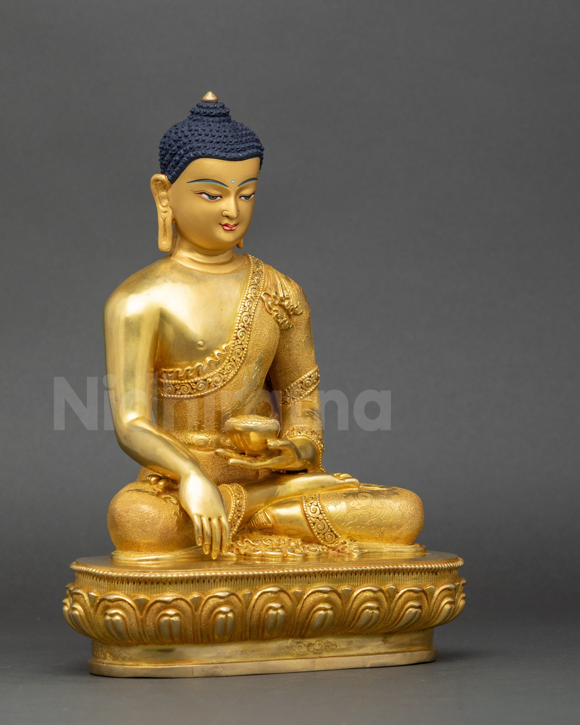 Shakyamuni Buddha statue right view side highlighting lotus posture and gilded finish