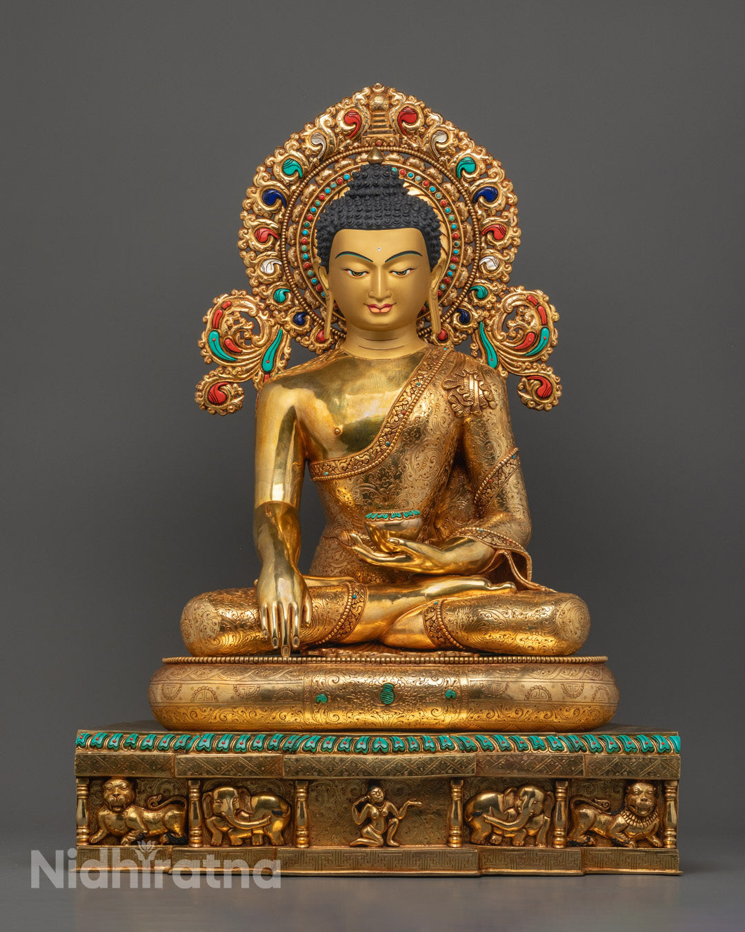 Shakyamuni Buddha statue’s gold-gilded face with radiant expression, handcrafted by Himalayan artisans