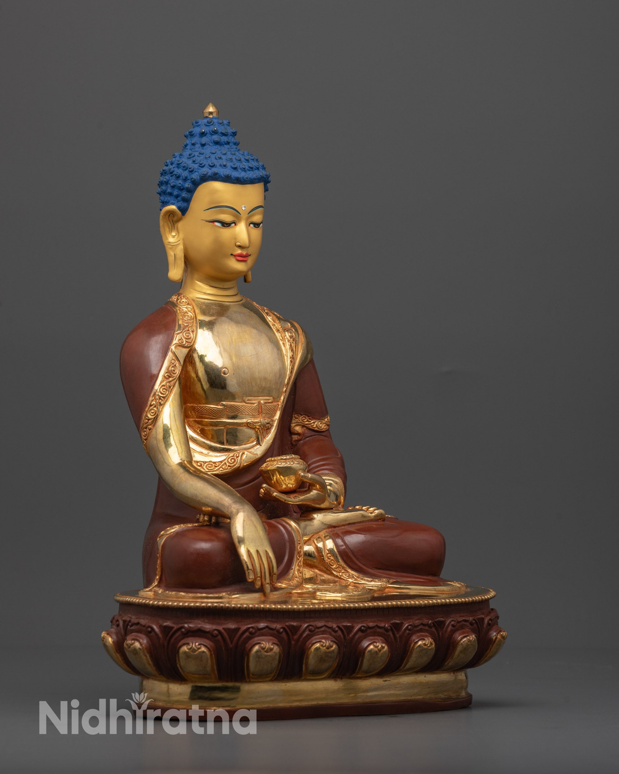 Side angle of partially fire-gilded Shakyamuni Buddha showing