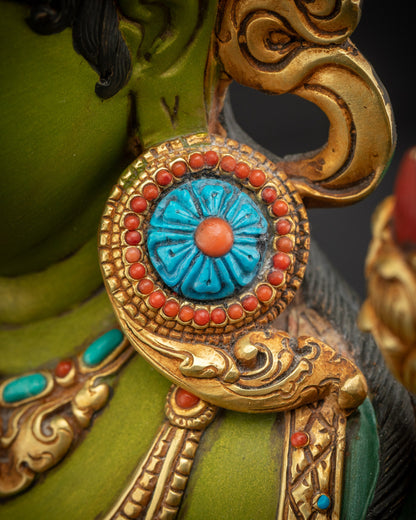 Detailed close up of Shyama Tara earrings showcasing intricate metalwork gemstone accents