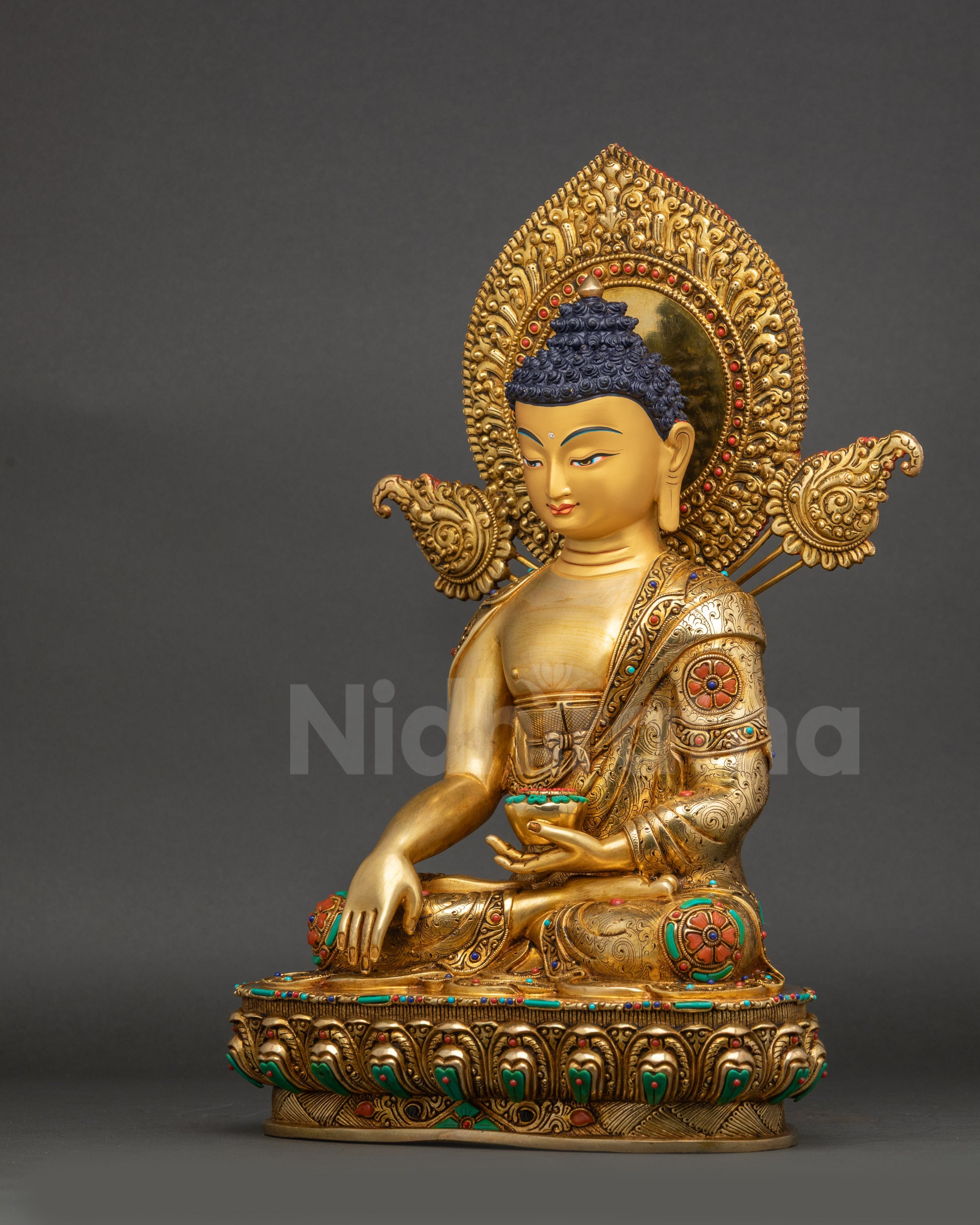 Siddhartha Gautama Buddha sculpture left side view halo and floral designs
