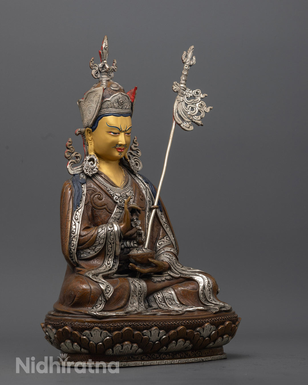 Tibetan Guru Rinpoche Statue highlighting traditional lost wax carving and spiritual symbolism.