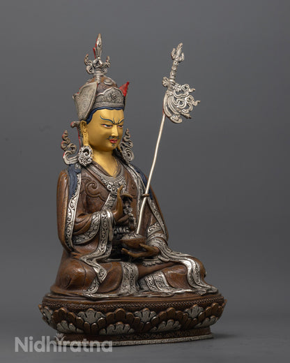 Tibetan Guru Rinpoche Statue highlighting traditional lost wax carving and spiritual symbolism.