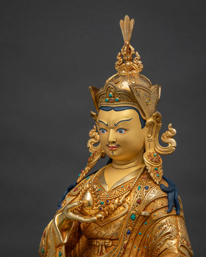 Side detail of Guru Norlha, hand-carved repoussé kasaya robes and inlaid semi-precious stones