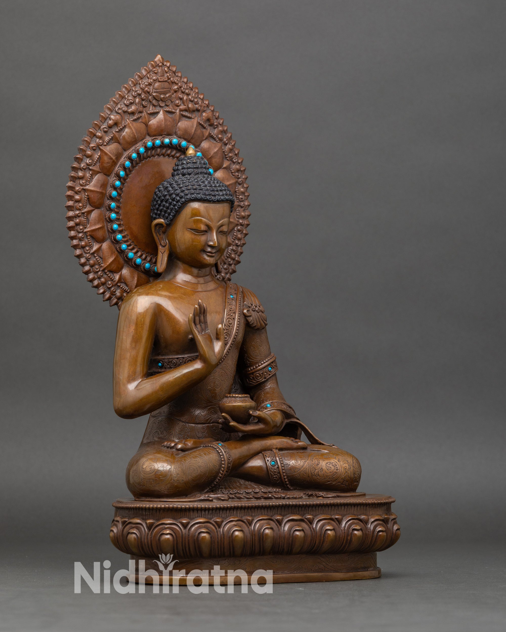 Side-view-Amoghasiddhi-Buddha-lotus-pedestal-elaborate-aureole-gold-oxidized-Nepalese-sculpture