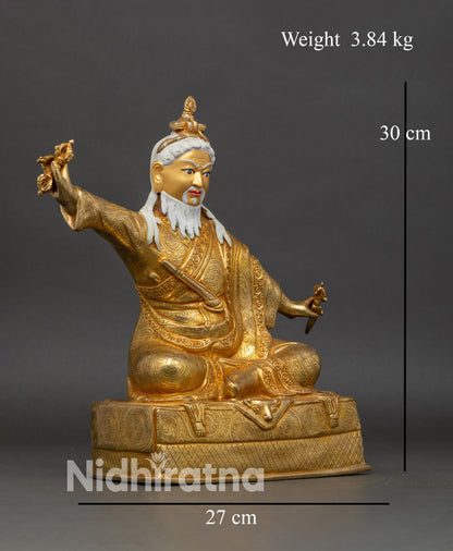 Side view Dudjom Lingpa Rinpoche statue, royal ease posture with gold-painted robes