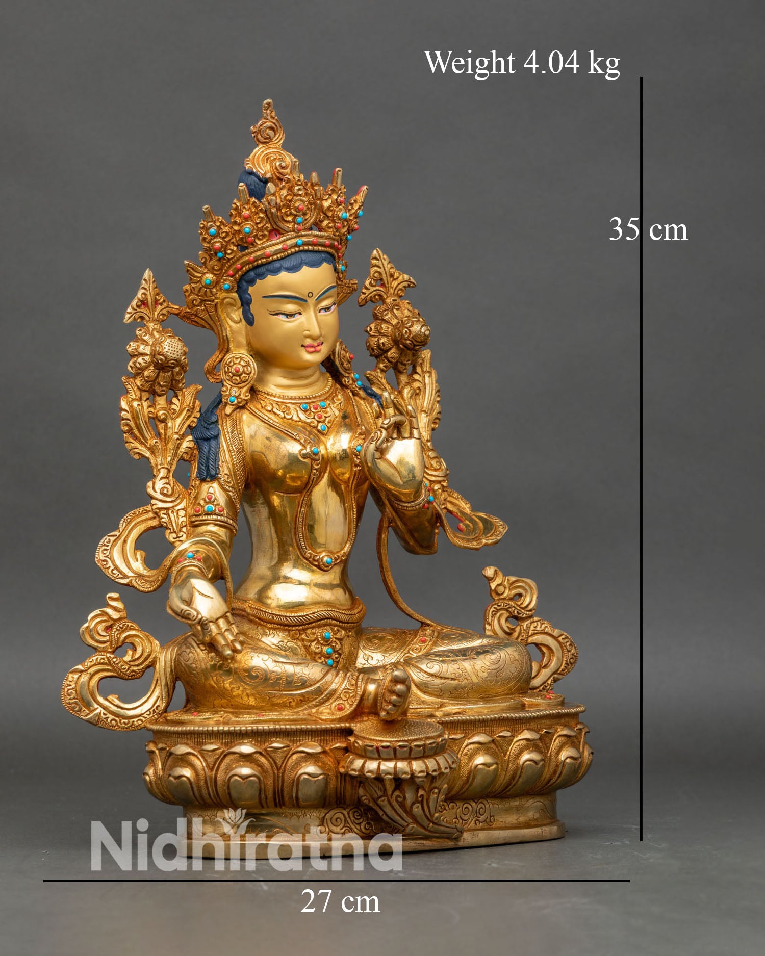 Side view of Green Tara statue right leg extended lotus throne Tibetan Buddhist goddess