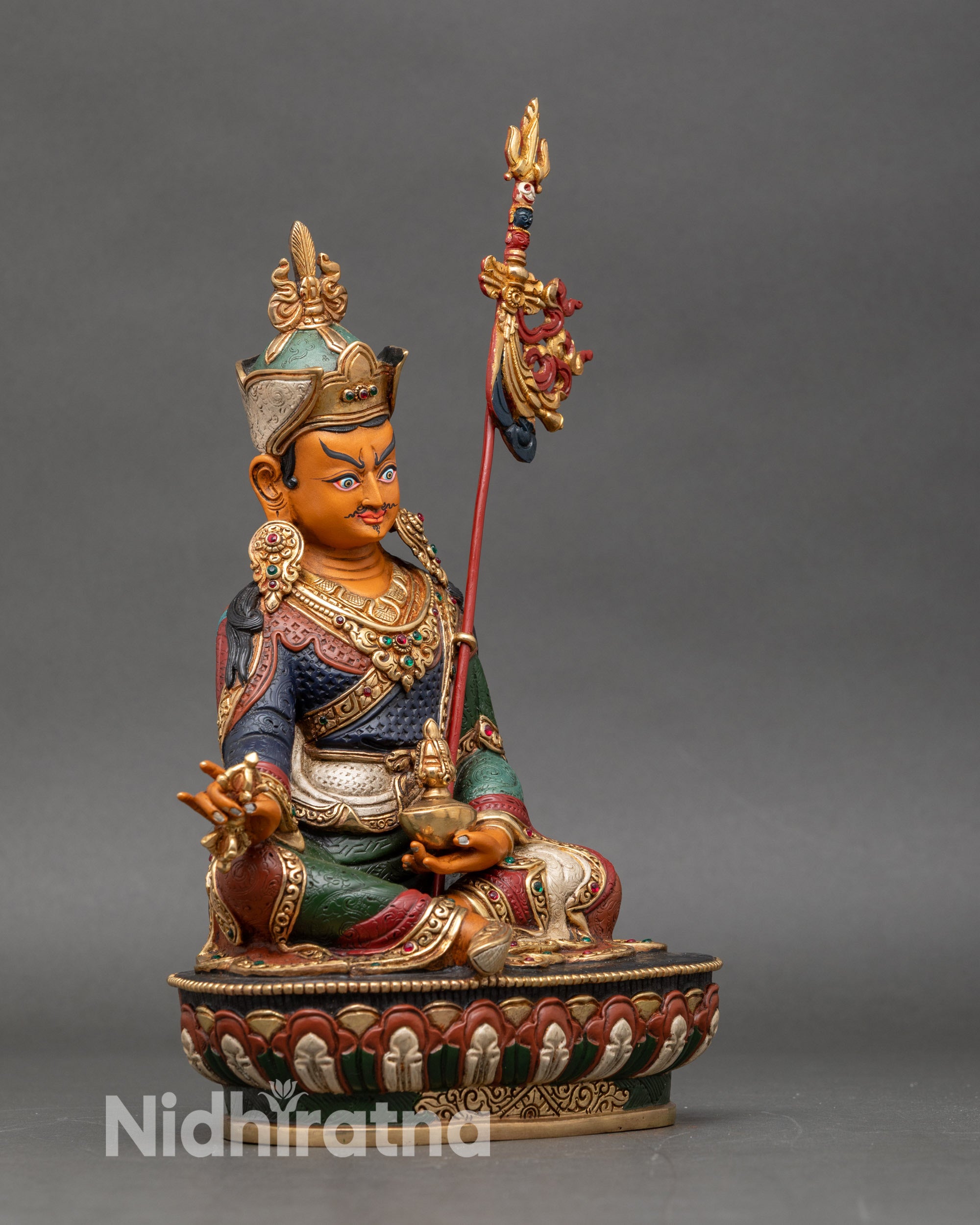 Side-view-Guru-Rinpoche-statue-seated-lotus-pedestal-royal-posture-Buddhist-sculpture-Nepalese-art