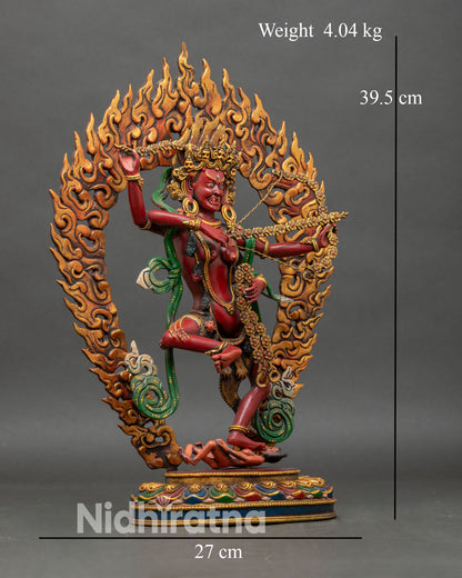 Side view of Kurukulla statue, lotus pedestal four arms bow arrow hook noose