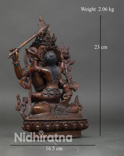 Side view of Manjushri with Consort Statue lotus pedestal oxidized copper spiritual decor