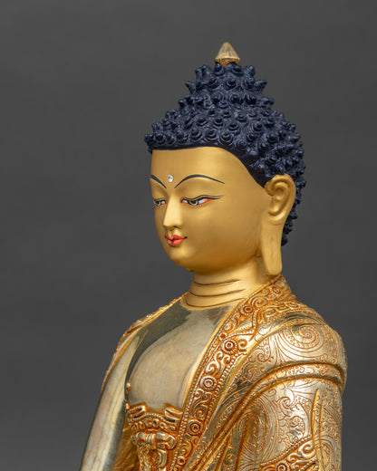 Side view close-up of Shakyamuni Buddha statue highlighting engraved robe and lotus seat