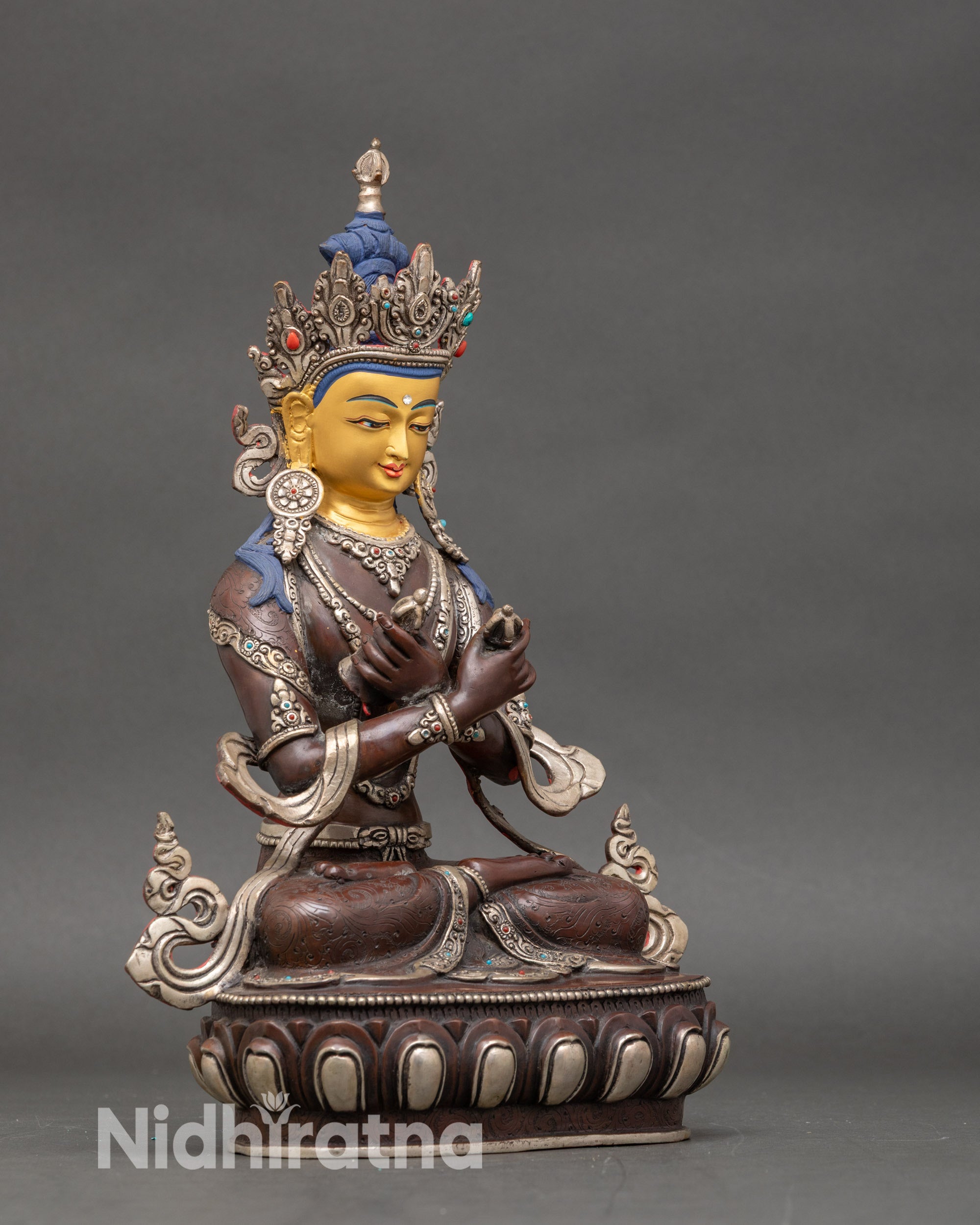 Side view of Vajradhara statue on lotus throne, traditional Newari lost-wax craftsmanship