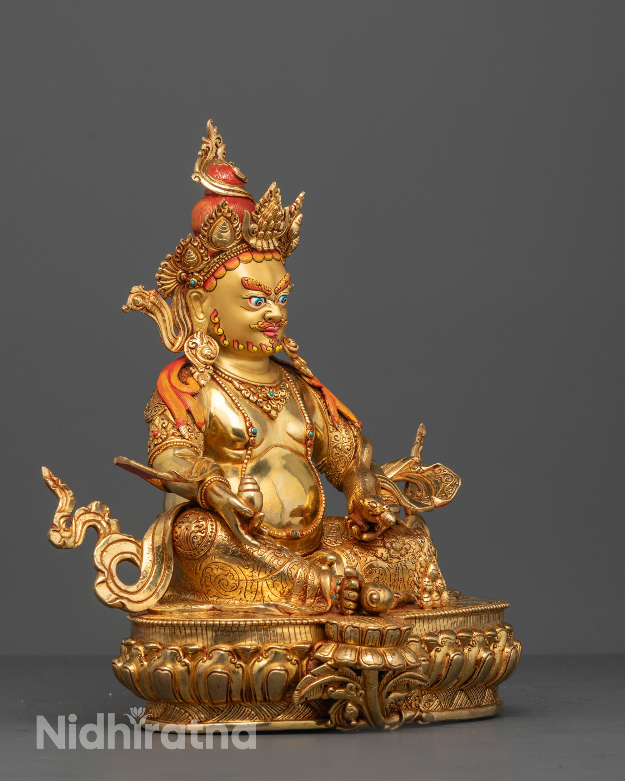 Side Angle of Dzambhala Seated on a Lotus Throne with Detailed Robes