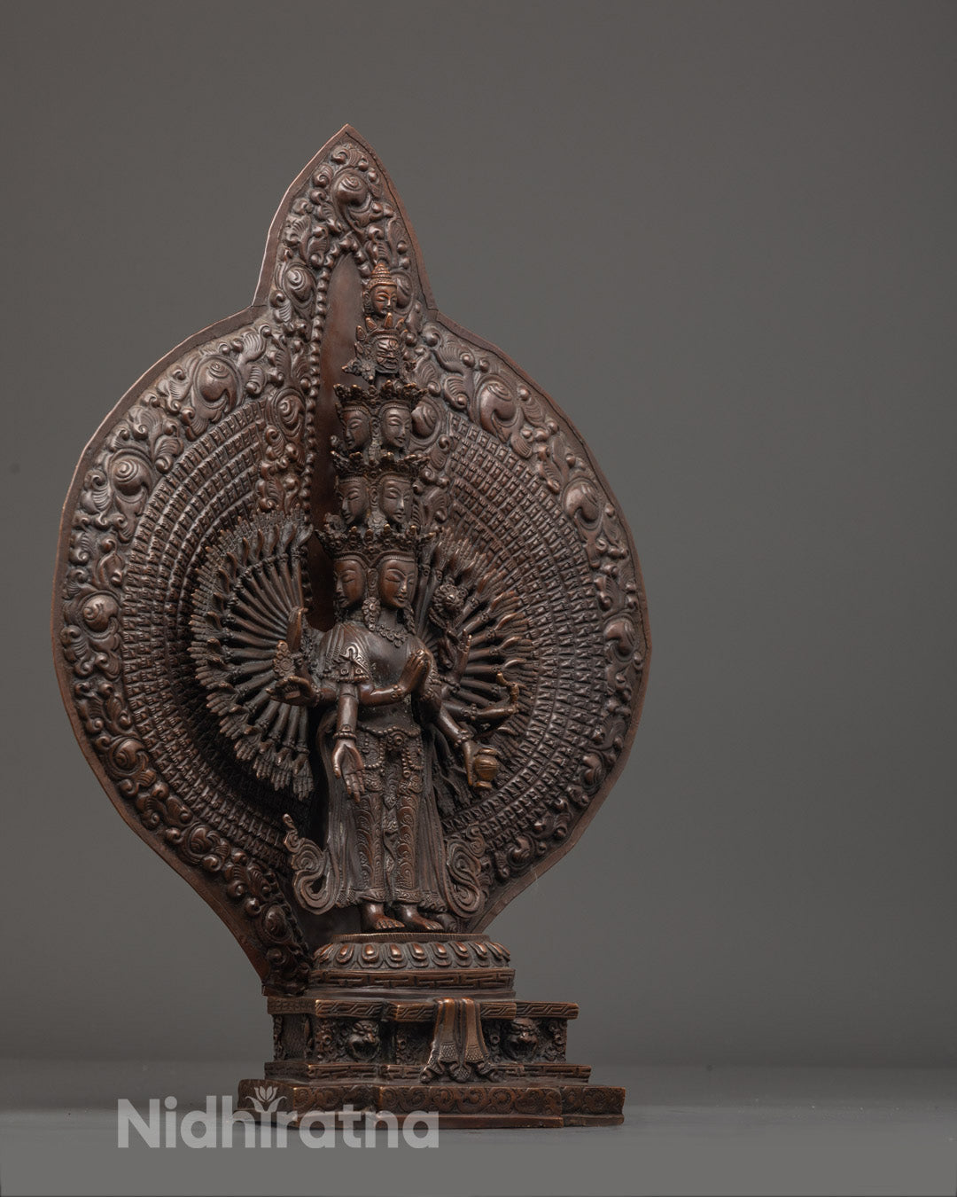 Hand-Carved Thousand-Armed Avalokiteshvara Statue Highlighting Intricate Arm Placement and Acrylic Color Accents