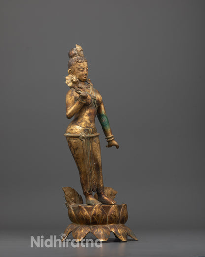 Side Angle of Mayadevi Statue Highlighting Detailed Robes and Gold Finish