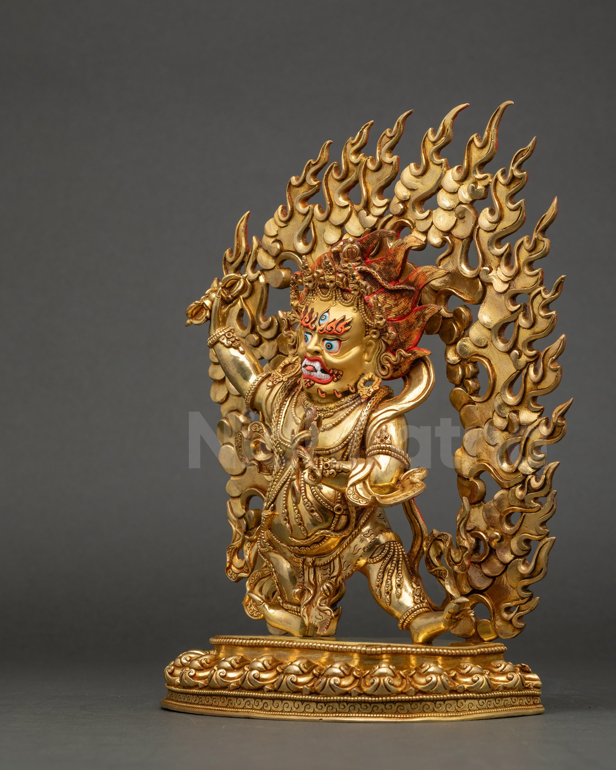 Side view close-up showing triple gold fire-gilding, 3D carvings, and ceremonial robe