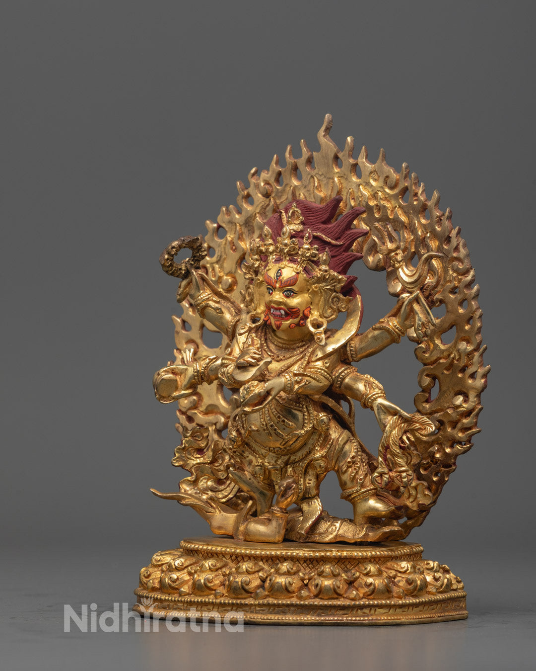 Side View of Mahakala Statue Holding Ritual Objects in Each Hand