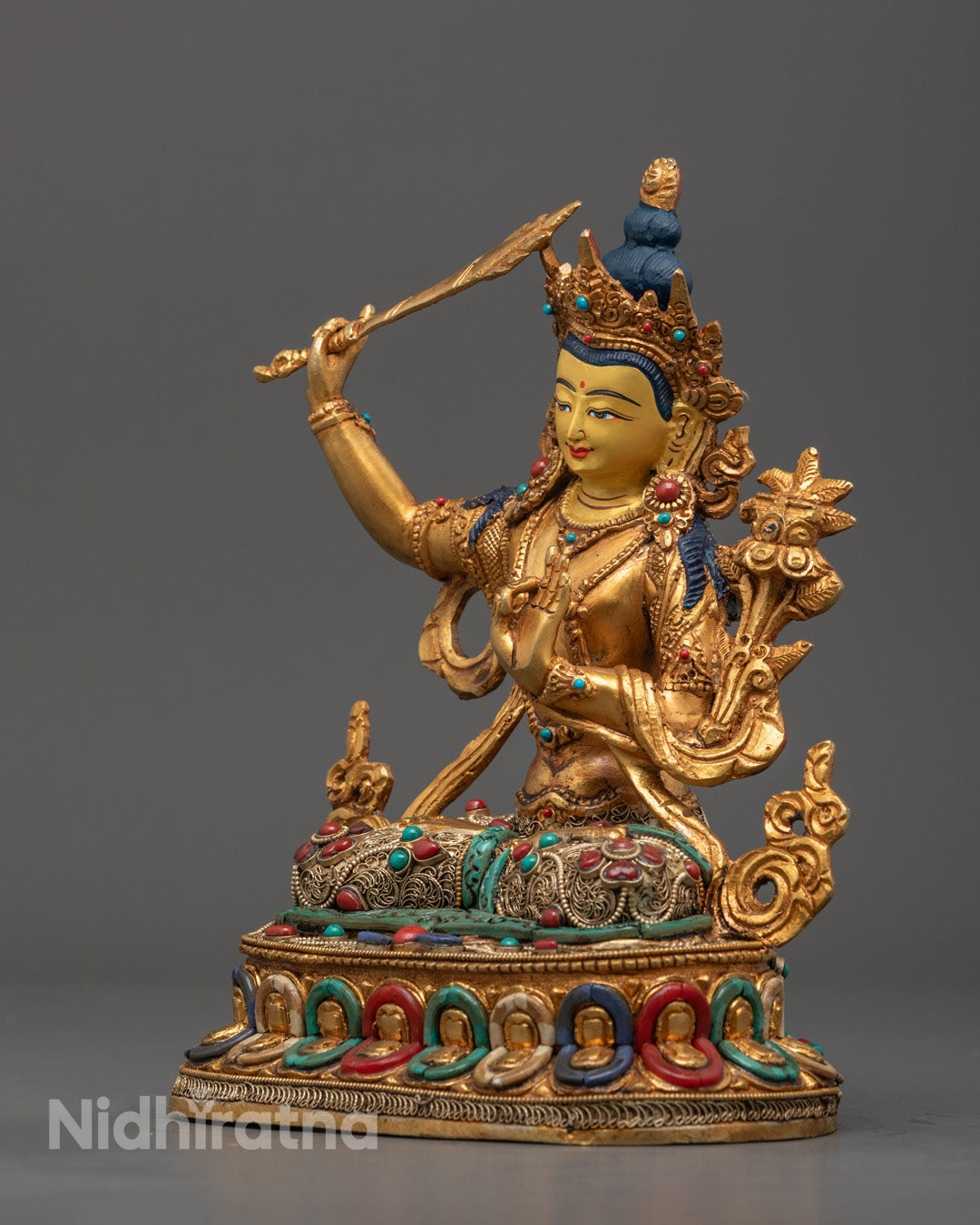 Traditional Tibetan Manjushri Sculpture with Detailed Robes and Lotus Base