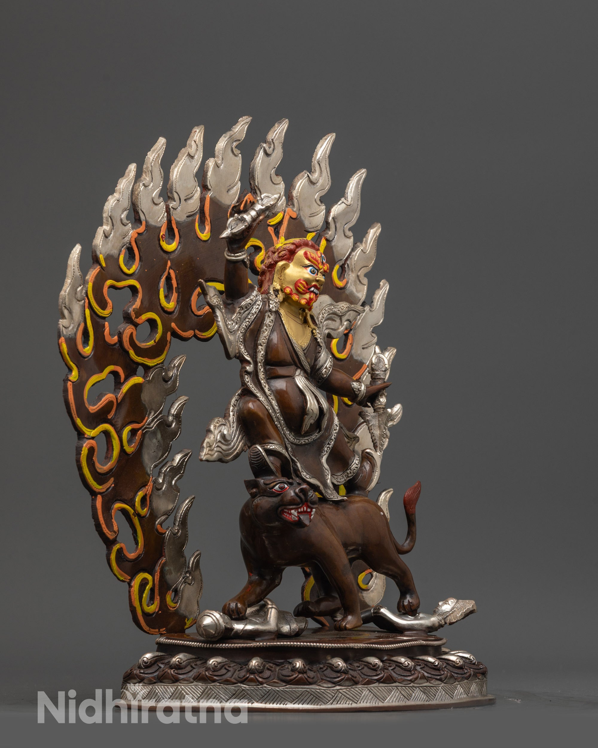 Side angle Dorje Drolo sculpture with carved robe, Dorje, Purbha and flaming halo
