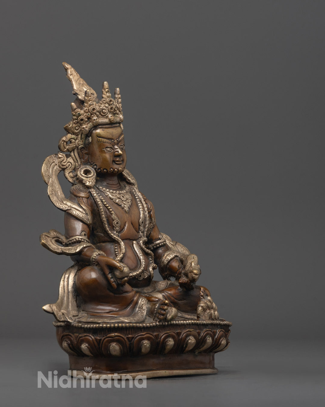 Side angle Dzambhala Wealth Sculpture oxidized copper silver-plated Tibetan guardian art
