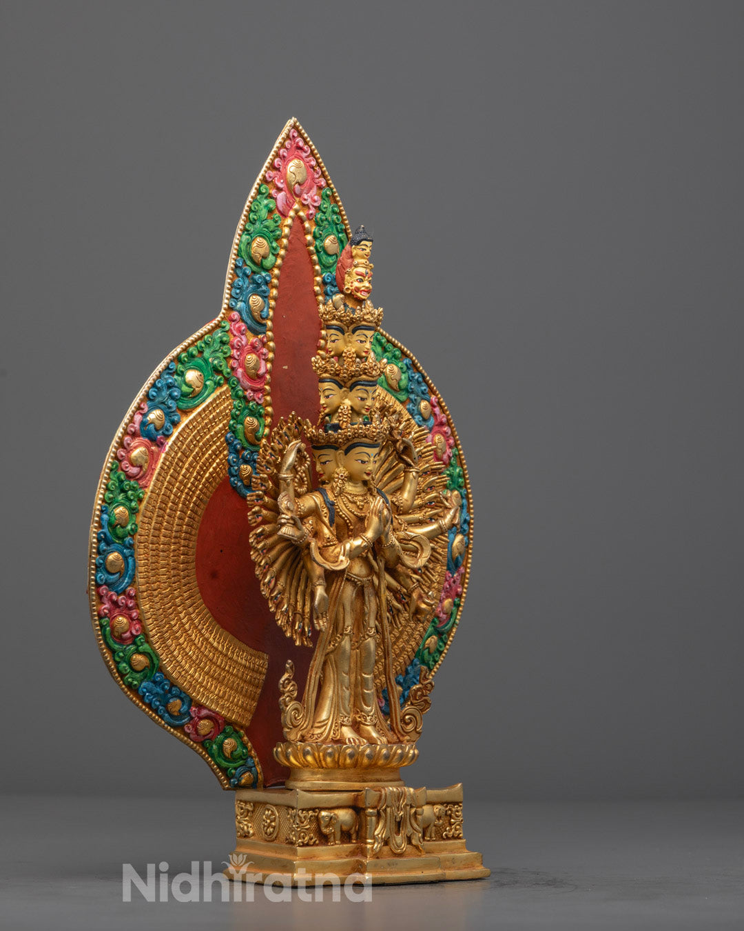 1000-Armed Avalokiteshvara statue showing gold embellishments, semi-precious stone inlays, and a serene facial expression.