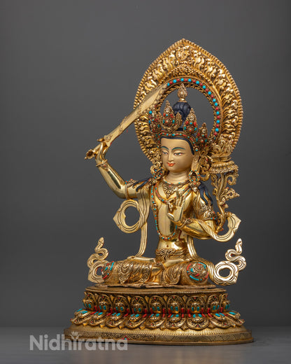 Side angle of Bodhisattva Manjushri statue showing sword, flower, and flowing robe