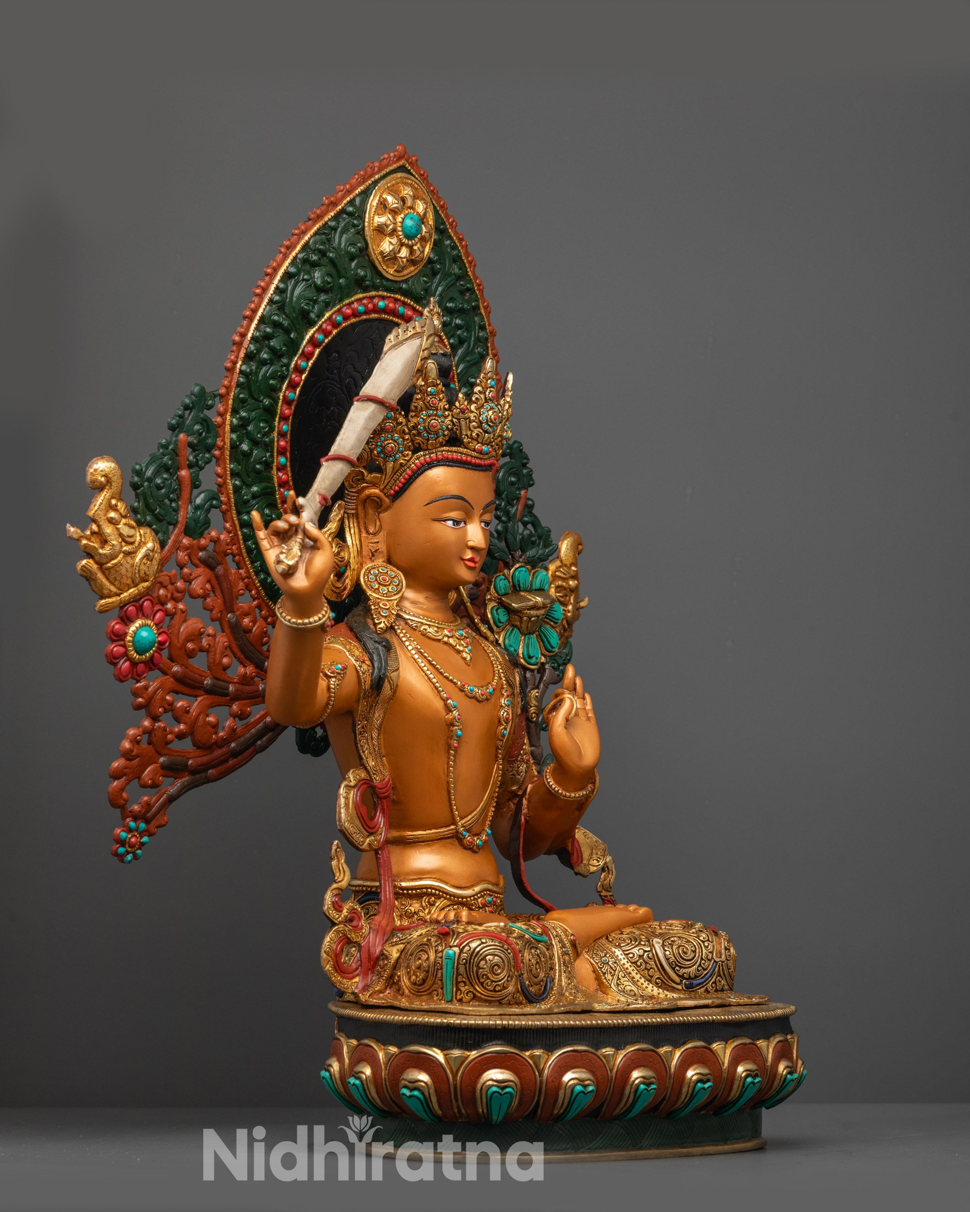 Side angle of Coloured Manjushri Statue showing lotus base and intricate carvings