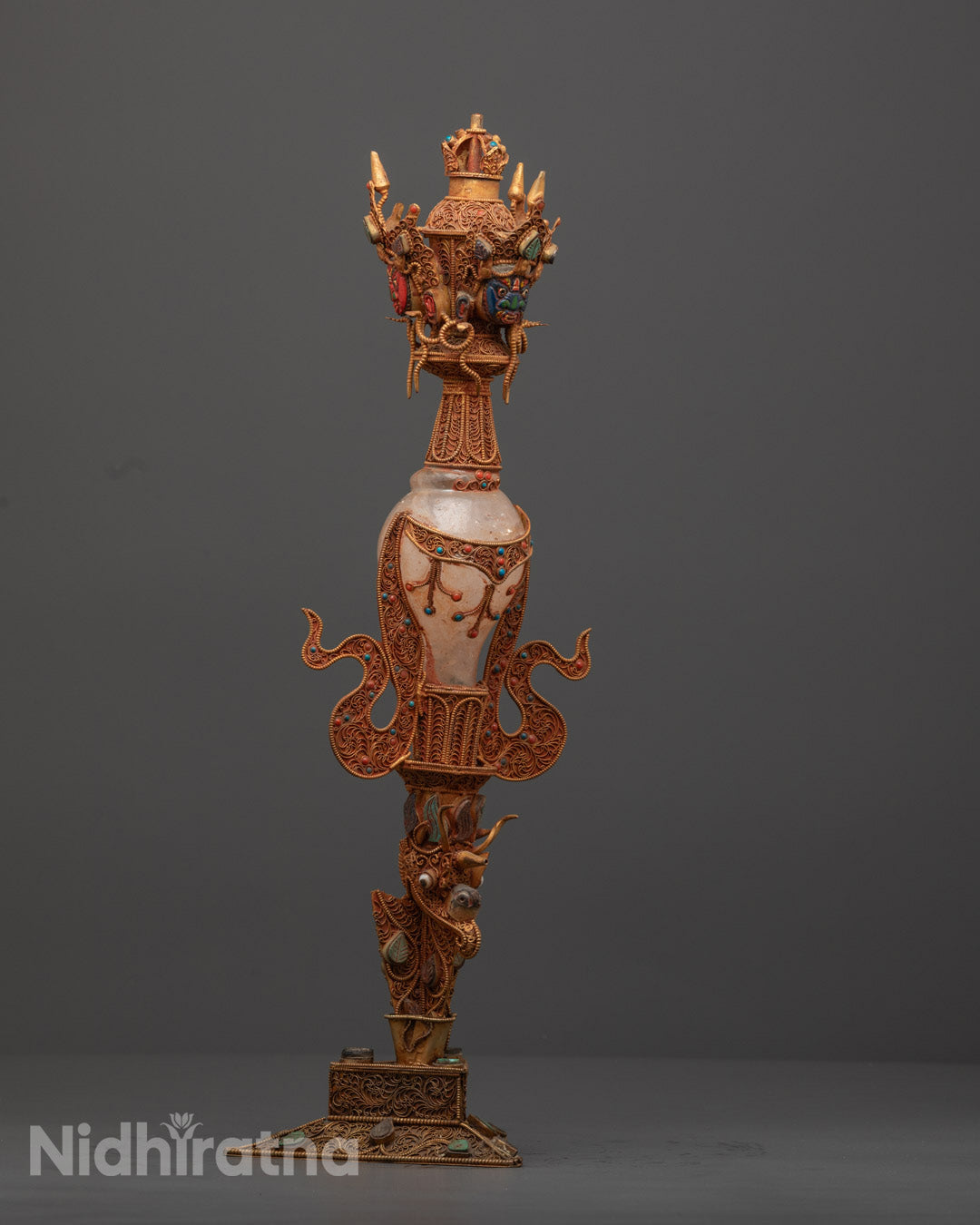 Side angle of Crystal Phurba showcasing intricate carvings and ritual symbolism