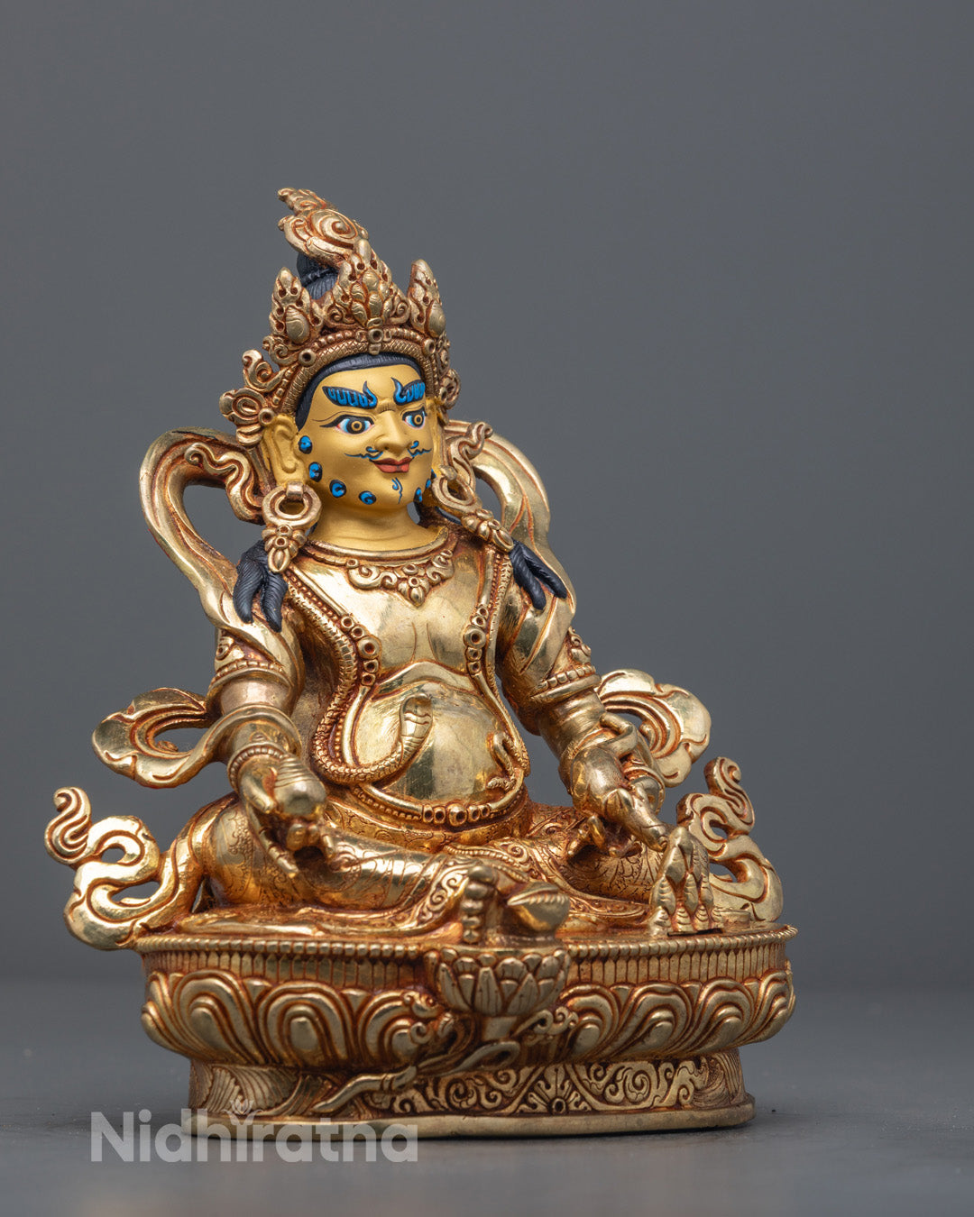 Dzambhala Buddha of Wealth sculpture showing hand-carved copper craftsmanship from Nepal