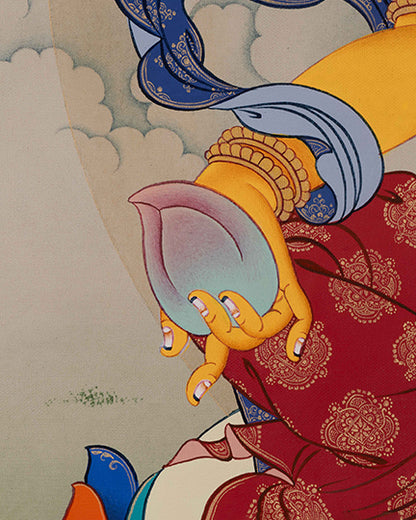 Side angle of Dzambhala Thangka highlighting citron fruit and ornate lotus seat details
