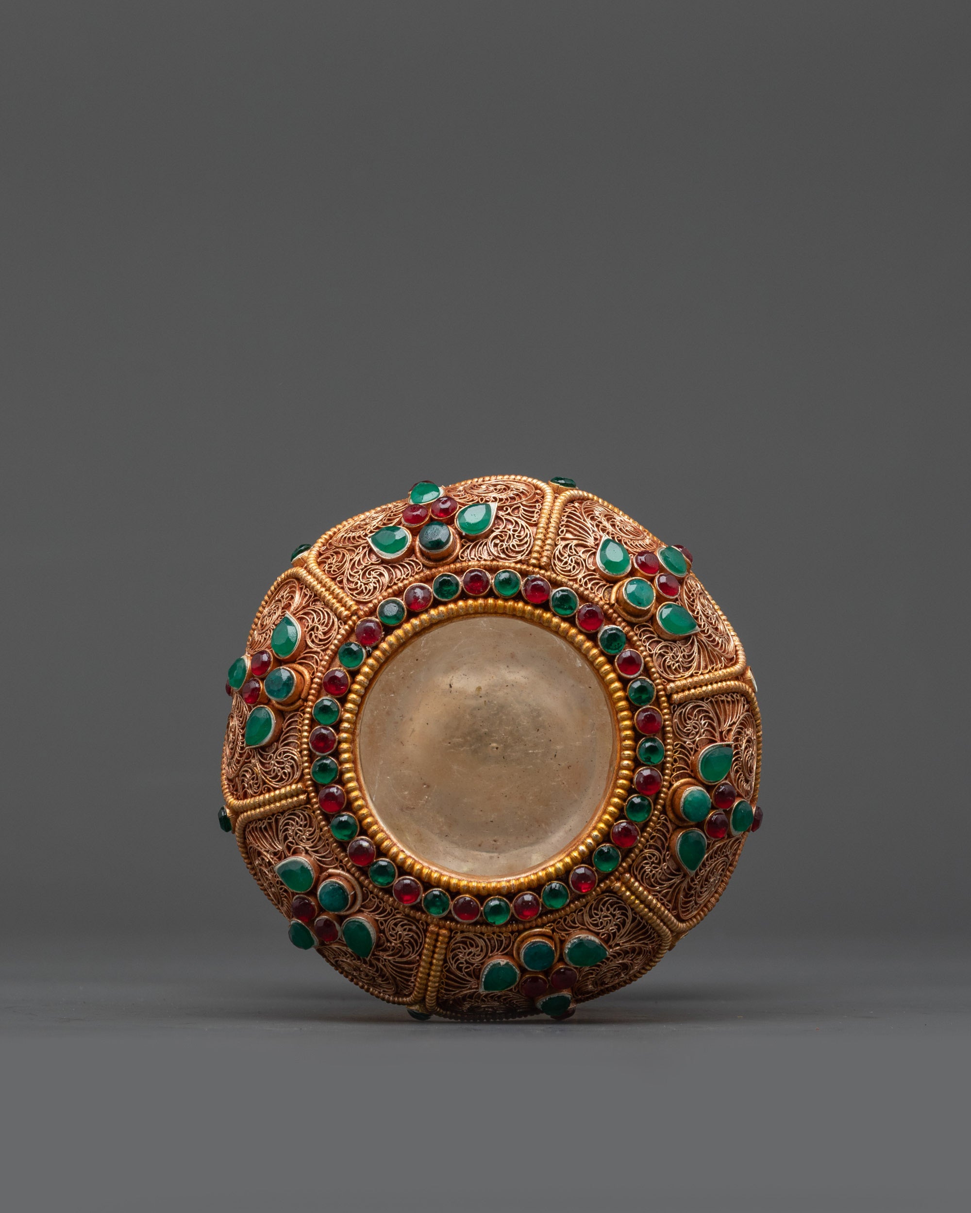 Side angle of Handmade Copper Rice Pot with crystal core and deity carvings