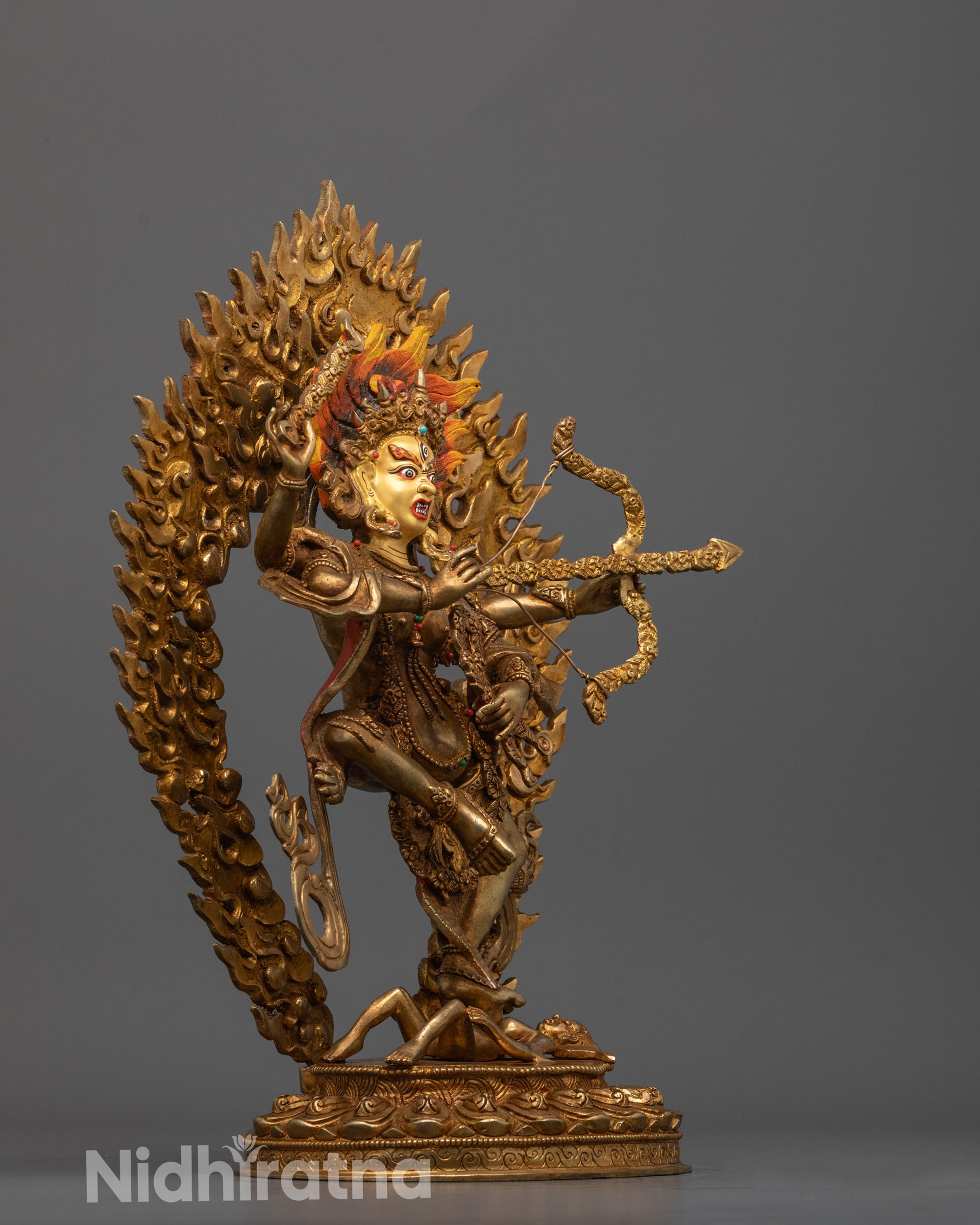 Side angle of Kurukulla Sculpture highlighting her flowing ornaments 