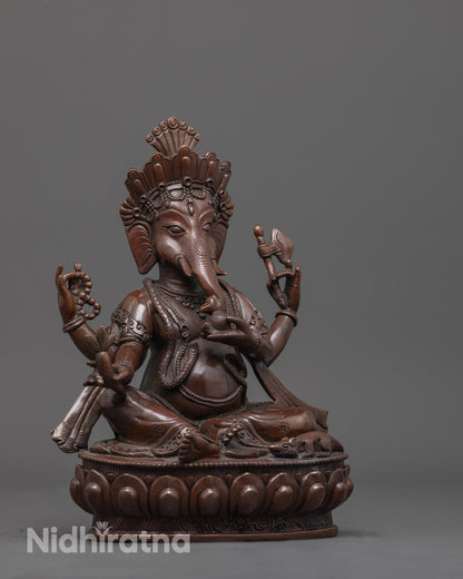 Side angle of Lord Ganesha statue with axe, rosary, and Mushika vehicle near feet visible.