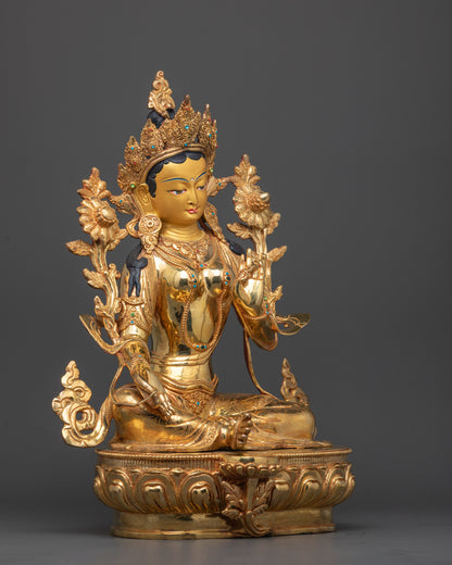 Side angle of Mother Tara Sculpture showing detailed utpala flower and flowing robe