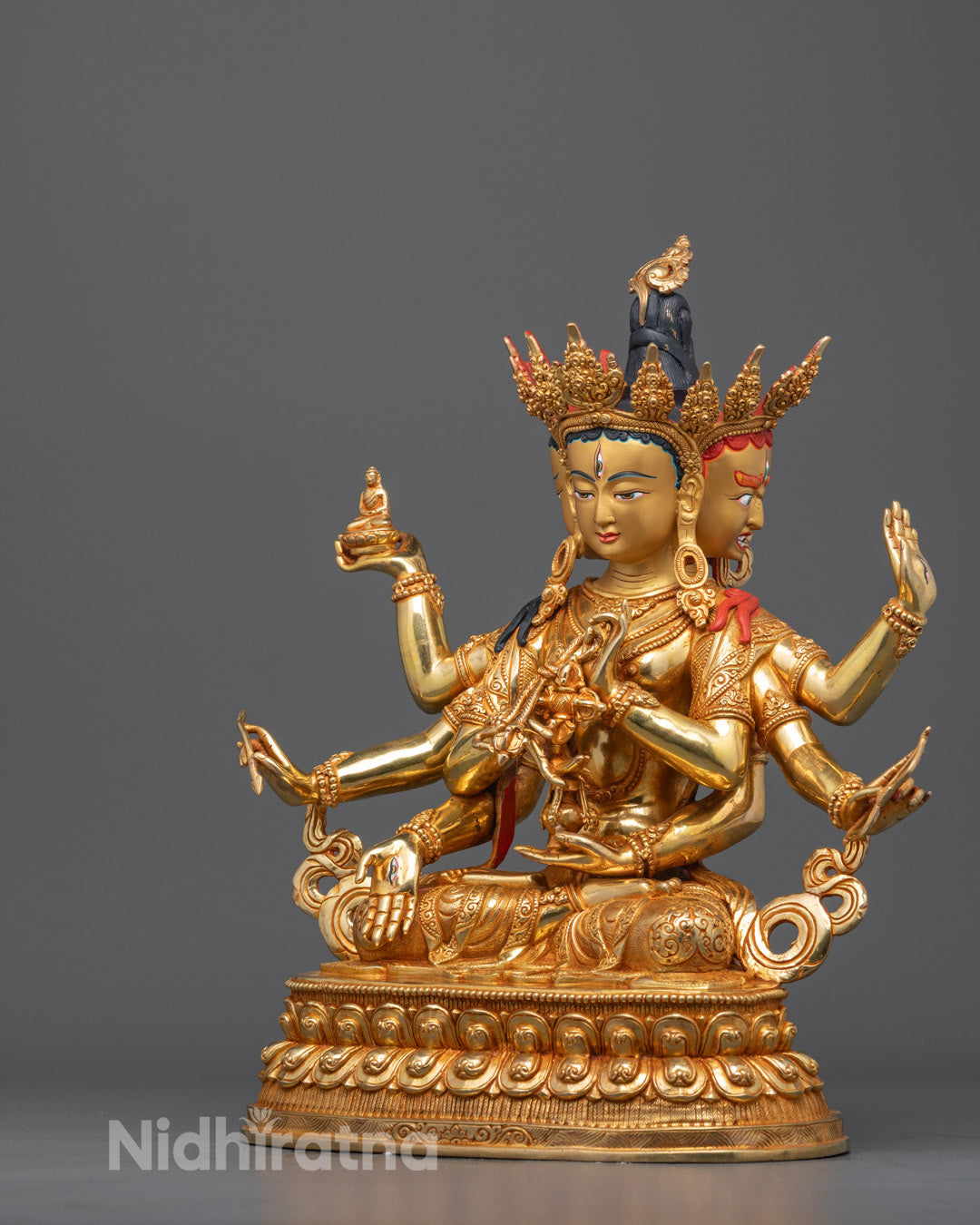 Side angle of Namgyalma Buddha sculpture showing detailed copper base