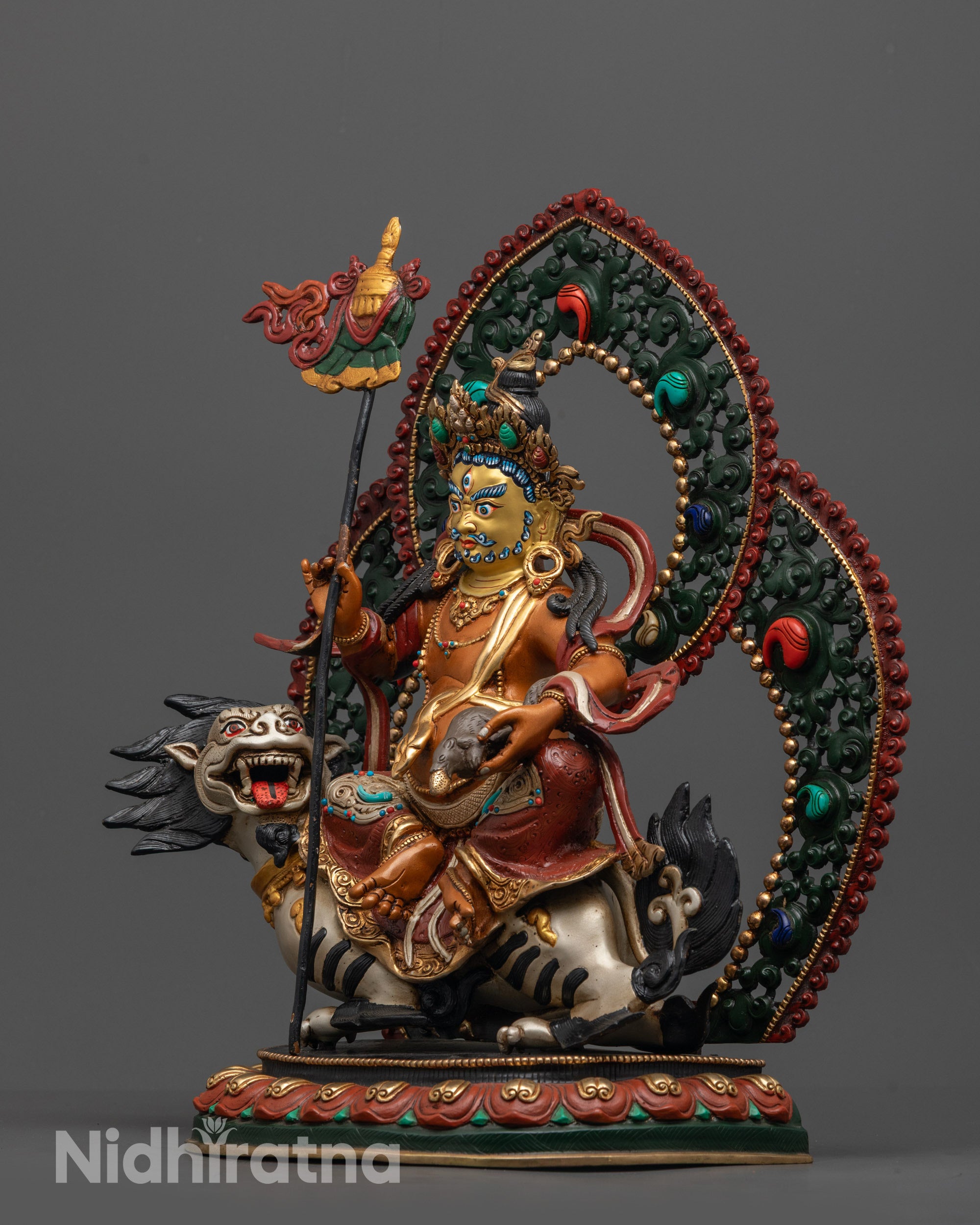 Side angle of Namtoshe Statue on snow lion holding Victory Banner and mongoose