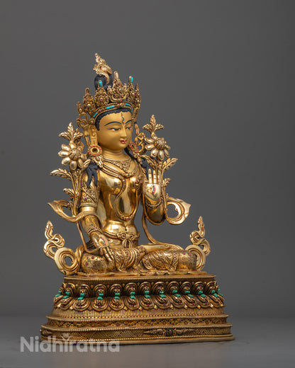 Side angle of Nepalese White Tara Sculpture showing varada mudra and lotus throne carvings