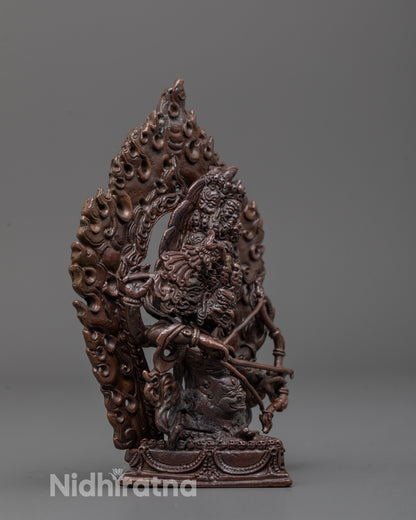 Side angle of Rahula Statue highlighting flowing robes and dynamic seated posture