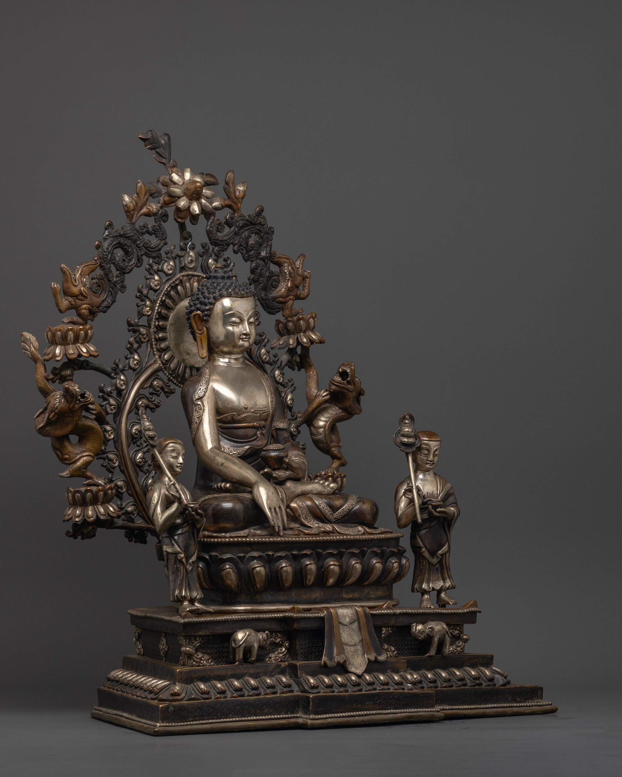 Side angle of Shakyamuni Buddha Statue highlighting lotus throne base